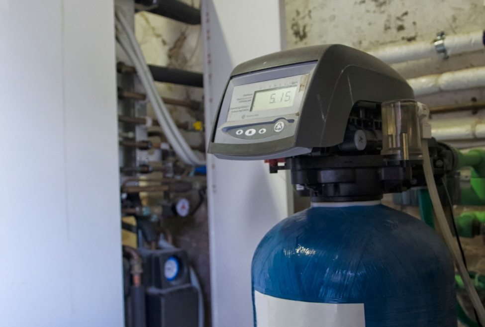 Residential water softener system installed by Neighborhood Plumbing, showing a whole-house water softener used to reduce hard water issues, improve plumbing efficiency, and lower maintenance costs. Ideal for homeowners searching "how much is a water softener system," "water softener installation near me," and "plumbing services for hard water. Contact us today for help with how much is a water softener system, cost of water softener installation, water softener system price, average price for a water softener, home water softener system cost, whole house water softener cost, how much does it cost to install a water softener, water softener installation near me, affordable water softener system, residential water softener system, water conditioning system cost, water softener system for hard water, water softener plumber near me, salt-based water softener price, plumbing services near me, plumbing installation for water softener, soft water system installation, local water softener system installers, home water filtration and softening, Neighborhood Plumbing water softener services.