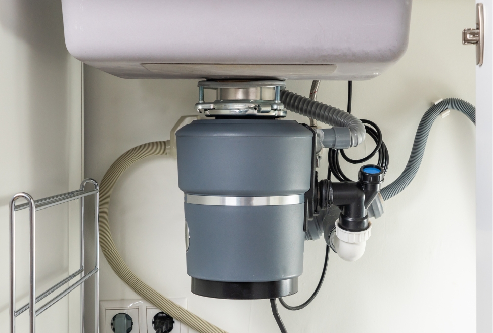 Modern garbage disposal under sink with stainless steel components, best garbage disposal for kitchen, top-rated garbage disposal unit, professional garbage disposal installation, garbage disposal replacement near me, clogged garbage disposal repair, residential plumbing services by Neighborhood Plumbing. Call today for help with best garbage disposal, top-rated garbage disposals, quietest garbage disposal, most powerful garbage disposal, garbage disposal reviews, best garbage disposal for kitchen sink, 1/2 hp vs 3/4 hp garbage disposal, InSinkErator vs Moen garbage disposal, best garbage disposal for home use, long-lasting garbage disposal, energy-efficient garbage disposals, affordable garbage disposals, garbage disposal repair near me, garbage disposal installation near me, garbage disposal replacement near me, clogged garbage disposal repair, leaking garbage disposal fix, residential plumbing services, local plumbing company, kitchen plumbing services, professional garbage disposal services, Neighborhood Plumbing garbage disposal service.