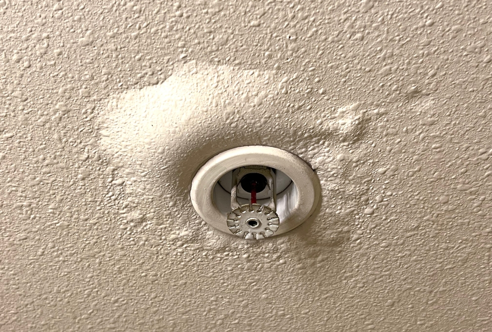 Ceiling leak with water damage near fire sprinkler showing signs of hidden water leaks, roof leak detection, and water damage repair services by Neighborhood Plumbing in Salt Lake City and nearby areas. Contact us today for help with how can a leak be detected, leak detection services, water leak detection near me, find hidden water leaks, detect plumbing leaks, slab leak detection, ceiling leak detection, roof leak repair, water damage repair, water leak inspection, leak detection specialists, leak detection companies near me, water pipe leak detection, emergency leak repair, professional leak detection services, detecting leaks in walls, detecting leaks under the floor, water leak repair near me, plumbing leak repair, leak detection and repair services.