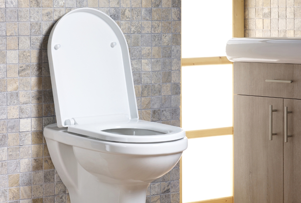 Standard white toilet in a bathroom, representing common toilet problems like constant running, weak flush, leaks, clogs, and repair issues; related to professional toilet repair and plumbing services by Neighborhood Plumbing. Contact us today for help with common toilet problems, toilet keeps running, toilet won’t flush, toilet flushing issues, weak toilet flush, toilet leaking at base, toilet tank not filling, toilet repair near me, clogged toilet fix, professional toilet repair, toilet flapper issues, toilet valve problems, plumbing services near me, toilet installation, emergency toilet repair, plumber for toilet leak, residential toilet repair, toilet plumbing near me, fix noisy toilet, water running in toilet tank, toilet maintenance services, local toilet plumber, toilet repair company near me.