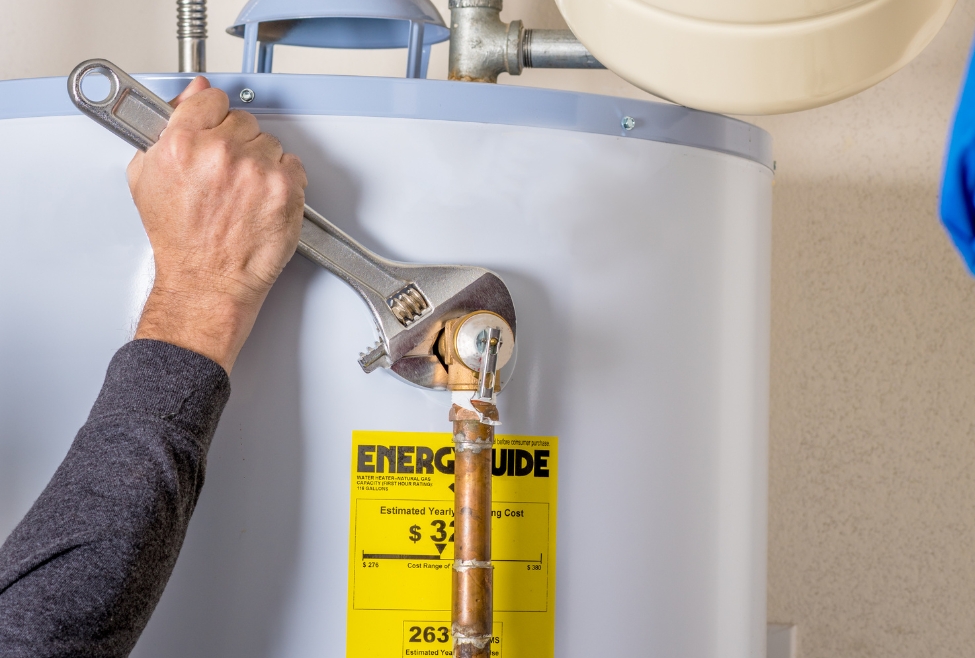 A modern water heater in a home showing the need for a professional water heater flush, maintenance, and inspection to prevent sediment buildup, leaks, and efficiency issues, demonstrating why a water heater flush is necessary by Neighborhood Plumbing. Contact us now for help with is a water heater flush necessary, water heater flushing, professional water heater maintenance, water heater cleaning service, flush water heater near me, water heater sediment removal, tank water heater flush, tankless water heater maintenance, water heater inspection, water heater repair, emergency water heater service, water heater maintenance near me, water heater flushing service, water heater replacement, how to flush a water heater, water heater efficiency improvement, water heater performance issues, water heater service near me, water heater upkeep, prevent water heater leaks.