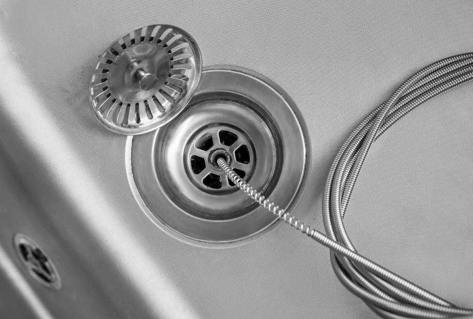 Close-up of a sink drain showing buildup, highlighting how to clean smelly sink drain, remove odors, prevent clogs, and maintain plumbing with professional Neighborhood Plumbing services. Reach out to us now for help with how to clean smelly sink drain, smelly kitchen drain solutions, sink odor removal, unclog smelly drain, drain cleaning services, drain odor repair, foul sink smell fix, best way to clean sink drain, prevent sink drain odor, smelly bathroom sink drain, clogged drain odor removal, professional drain cleaning near me, plumbing services for smelly drains, drain maintenance and cleaning, clean stinky sink drain, remove sewer smell from sink, Neighborhood Plumbing drain services near me, emergency drain cleaning near me, local plumbers for drain odor, fix smelly drain problems, drain inspection and cleaning, drain clog removal near me.