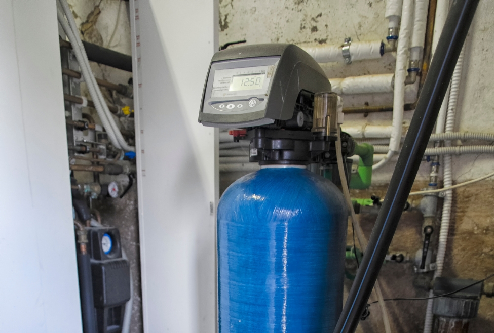 Residential water softener system installed in a home plumbing setup, illustrating is it worth putting in a water softener, helping reduce hard water scale buildup, pipe damage, and appliance wear while improving water quality and efficiency through professional water softener installation and plumbing services by Neighborhood Plumbing. Call us now for help with is it worth putting in a water softener, is a water softener worth it for hard water, benefits of installing a water softener, do I need a water softener in my home, should I install a water softener system, water softener pros and cons, water softener installation benefits, hard water solutions for home plumbing, how to fix hard water problems, signs you need a water softener, water scale buildup removal solutions, plumbing scale buildup prevention, water softener installation services, water treatment system installation, residential water softener installation, water softener repair services, plumbing maintenance for hard water, hard water damage prevention plumbing, water filtration and softening systems, water quality improvement services, water softener installation near me, water treatment systems near me, plumber for water softener near me, hard water solutions near me, plumbing services near me, water softener repair near me, home water treatment near me, water scale removal plumbing services near me.